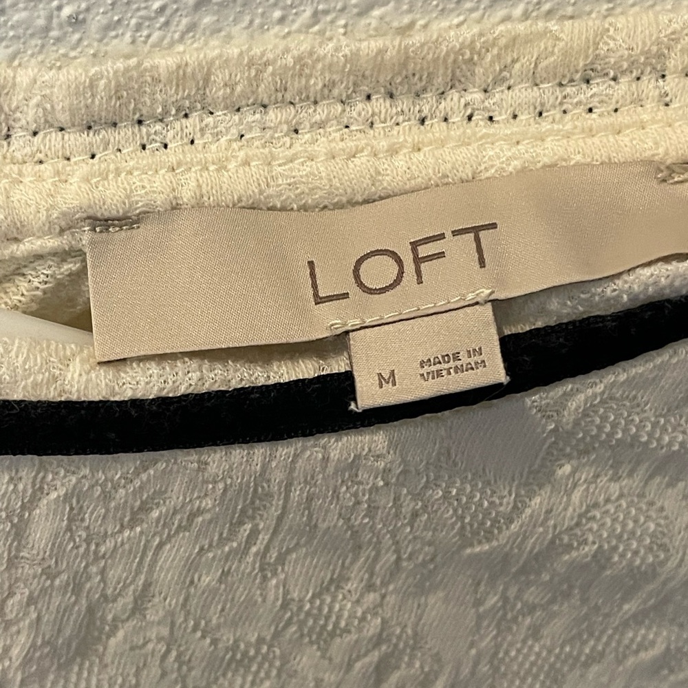 A white Loft shirt with a black collar
